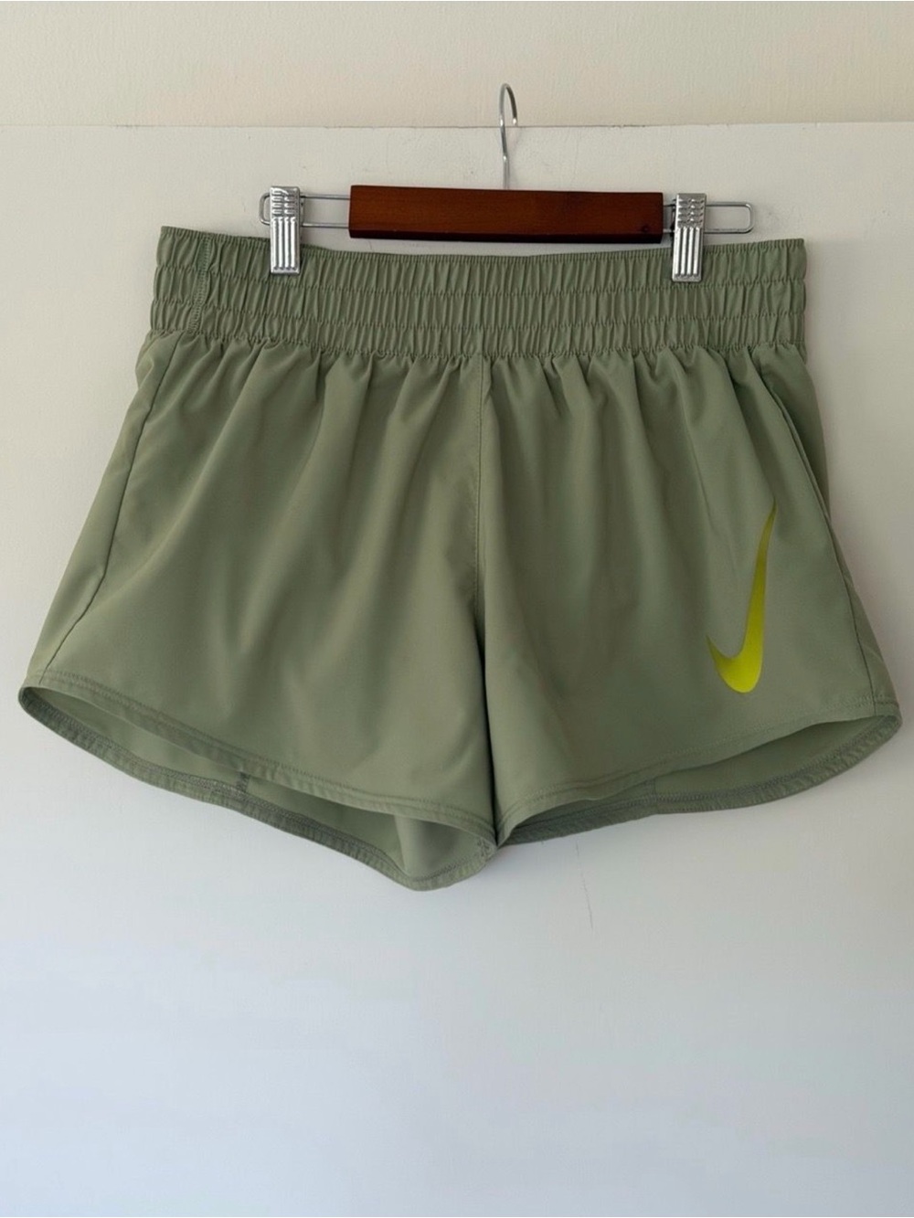 Nike Women's Olive Green Athletic Shorts with Lime Swoosh